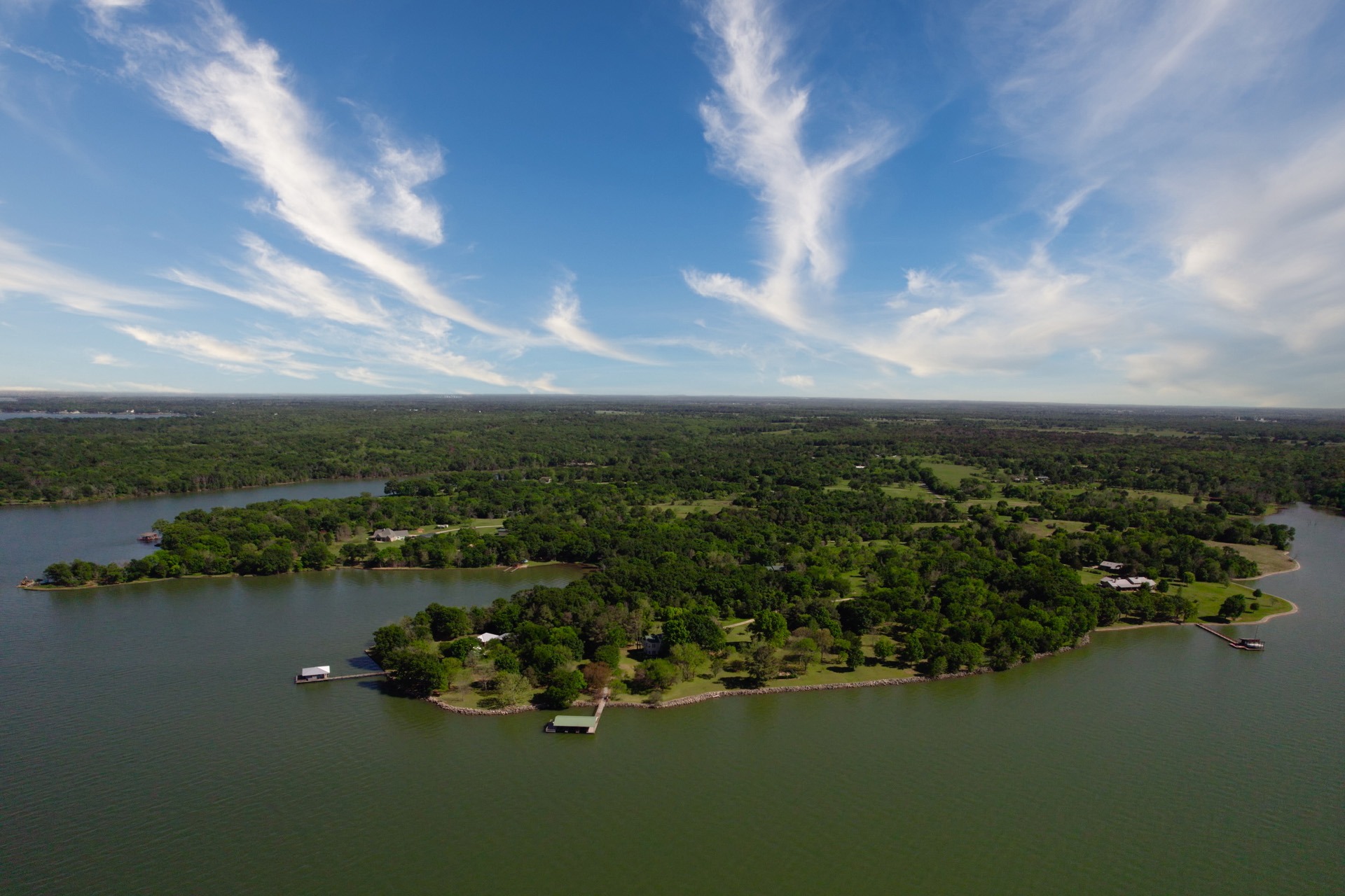 Wide angle drone shot lake house